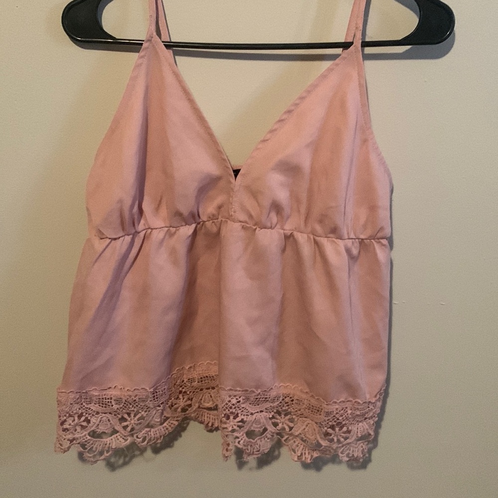 A dusty pink top with adjustable straps